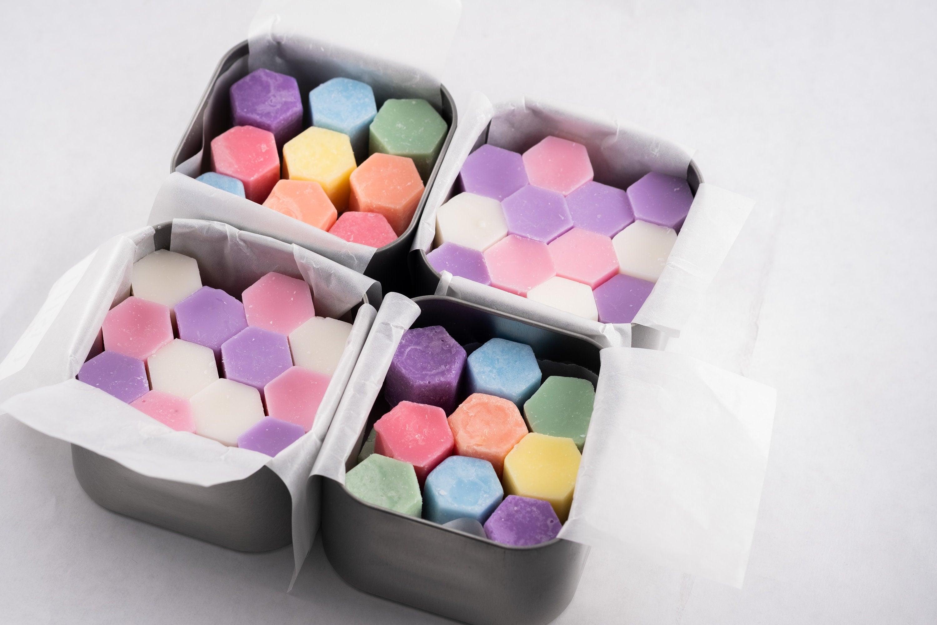 rainbow wax melts in square tins, hexagon shaped